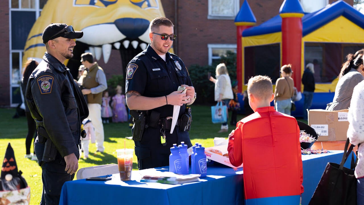 North Haven police engaging at a booth with the community