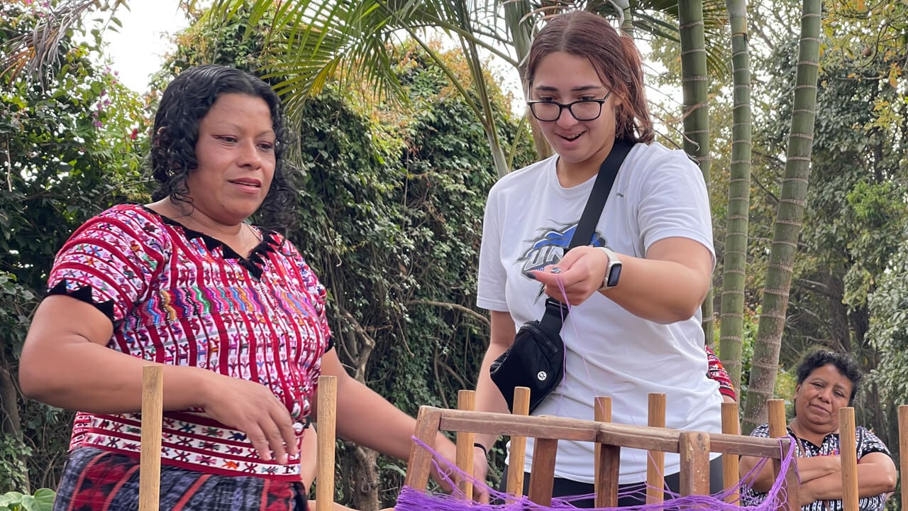 Emily Farley learns to weave traditional Maya clothing during Quinnipiac global learning trip.